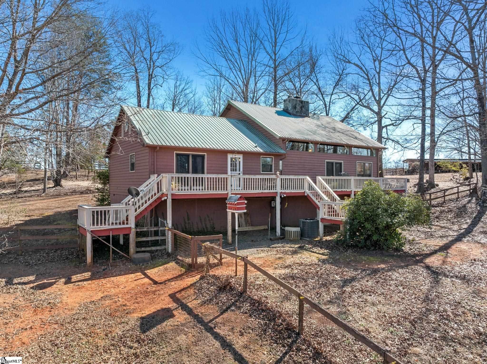 405 Loop Road Campobello, SC 29322 - Photo 8 of 49 The back deck spans the entire length of the house.