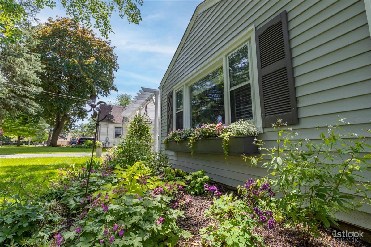 117 Polk Street Oswego, IL 60543 - Photo 3 of 34 a view of a garden with plants and large trees