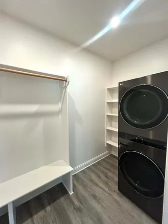 a utility room with sink dryer and washer