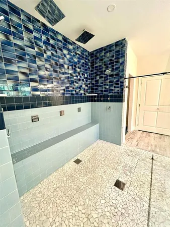 a view of bathtub and shower