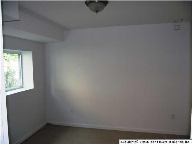 29 Midland Road Staten Island, NY 10308 - Photo 20 of 20 a view of an empty room and window