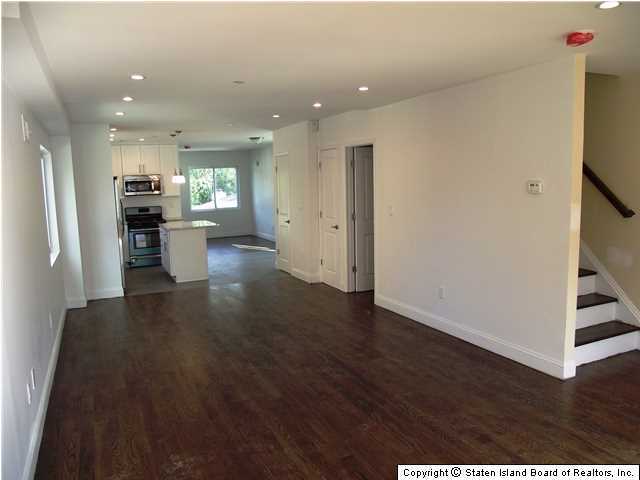 29 Midland Road Staten Island, NY 10308 - Photo 3 of 20 a view of a living room and dining room