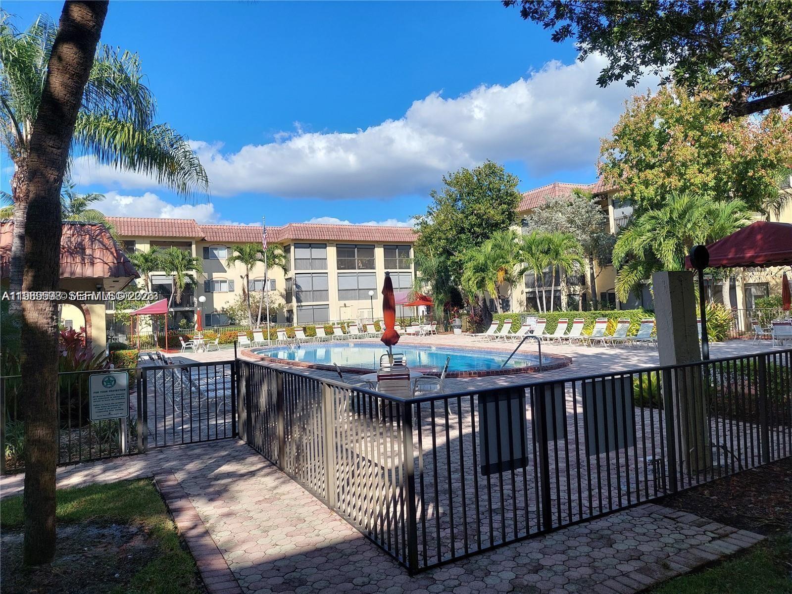 253 South Cypress Road, Unit 214 Pompano Beach, FL 33060 - Photo 14 of 25 a view of city from a balcony