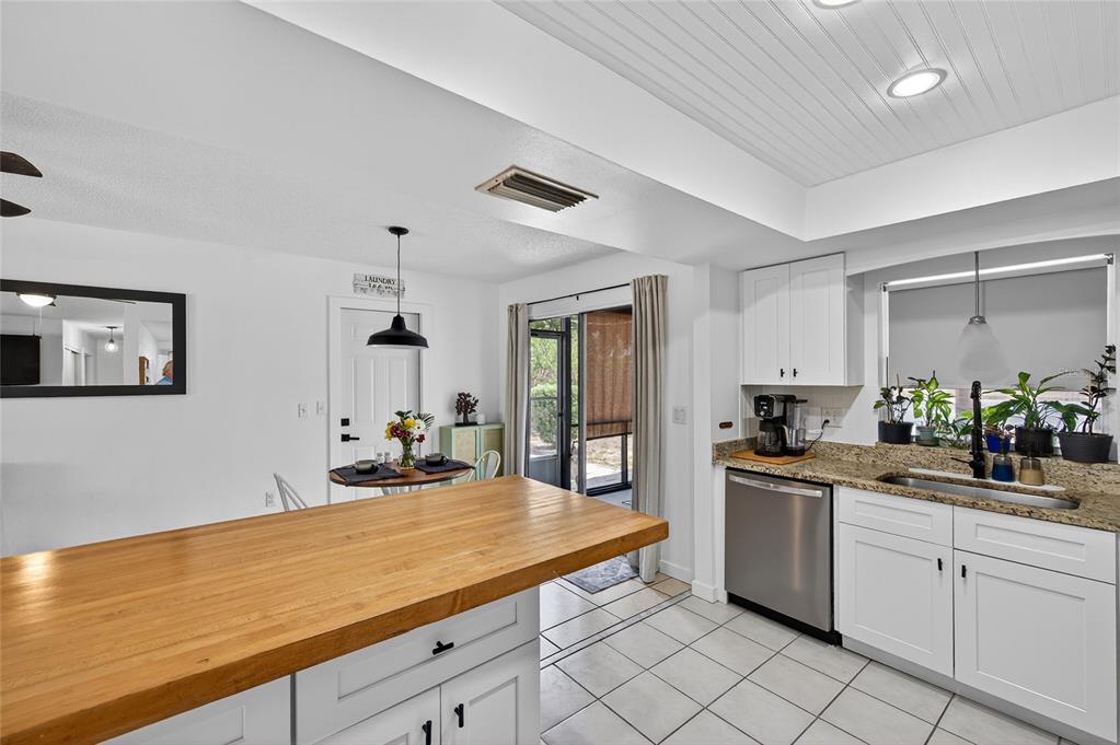 532 Center Road Venice, FL 34285 - Photo 44 of 68 a kitchen with stainless steel appliances a sink dishwasher stove refrigerator and cabinets