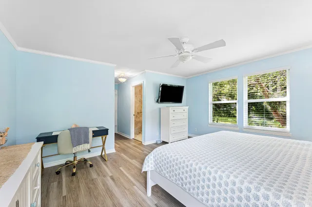 a bedroom with a bed and a view of bathroom