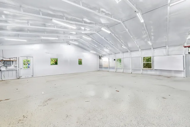 a view of a field of grass and trees