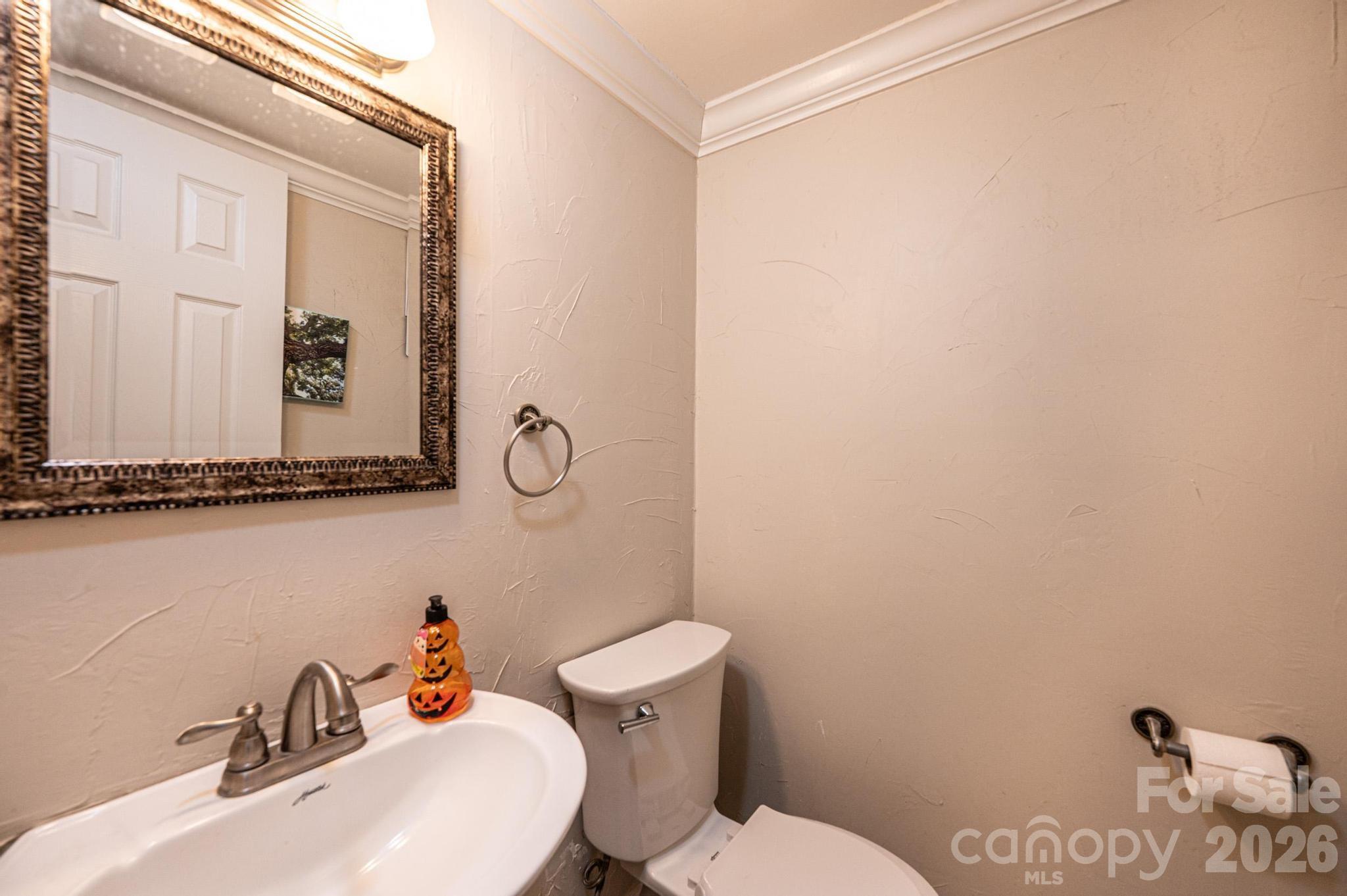 826 6th Street Northwest, Unit 4 Hickory, NC 28601 - Photo 13 of 25 a bathroom with a toilet sink and mirror