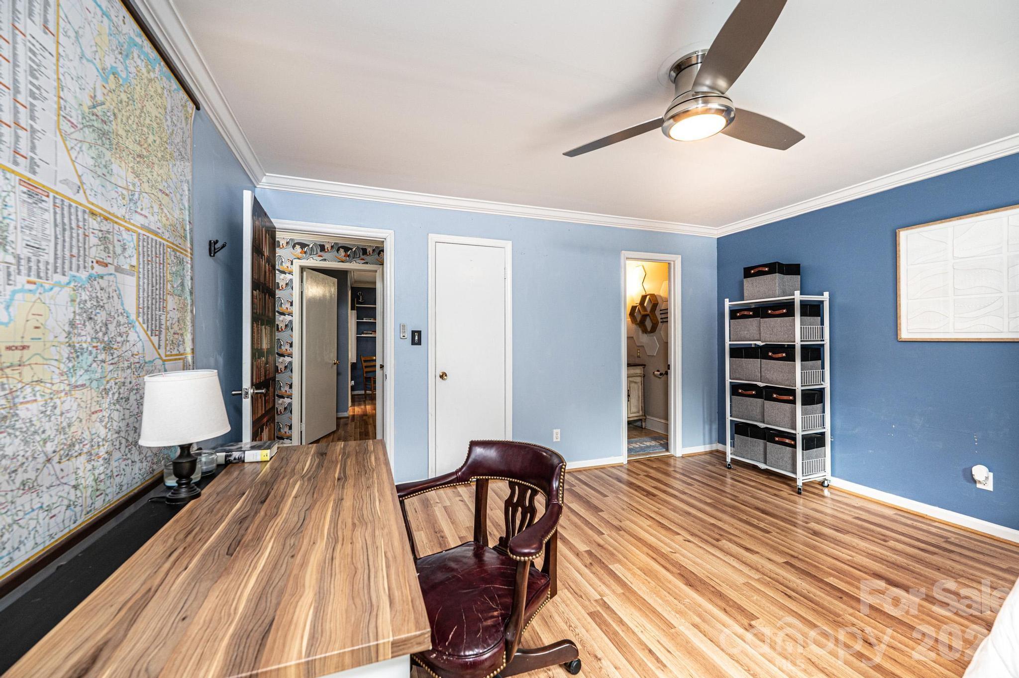 826 6th Street Northwest, Unit 4 Hickory, NC 28601 - Photo 15 of 25 a bedroom with a bed and wooden floor