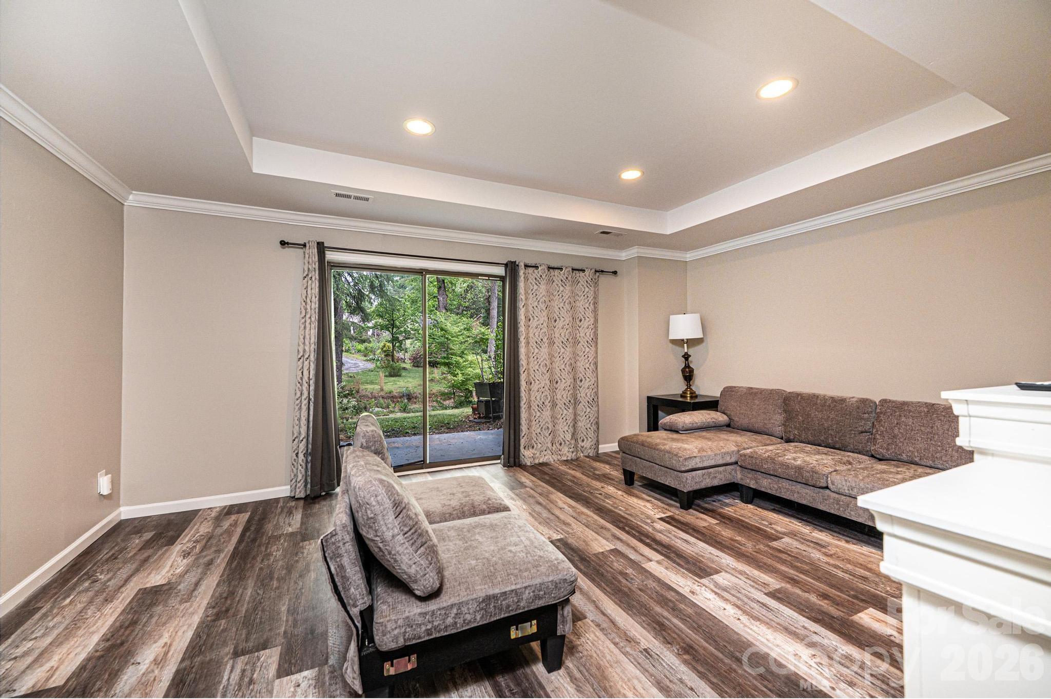 826 6th Street Northwest, Unit 4 Hickory, NC 28601 - Photo 20 of 25 a living room with furniture and a large window