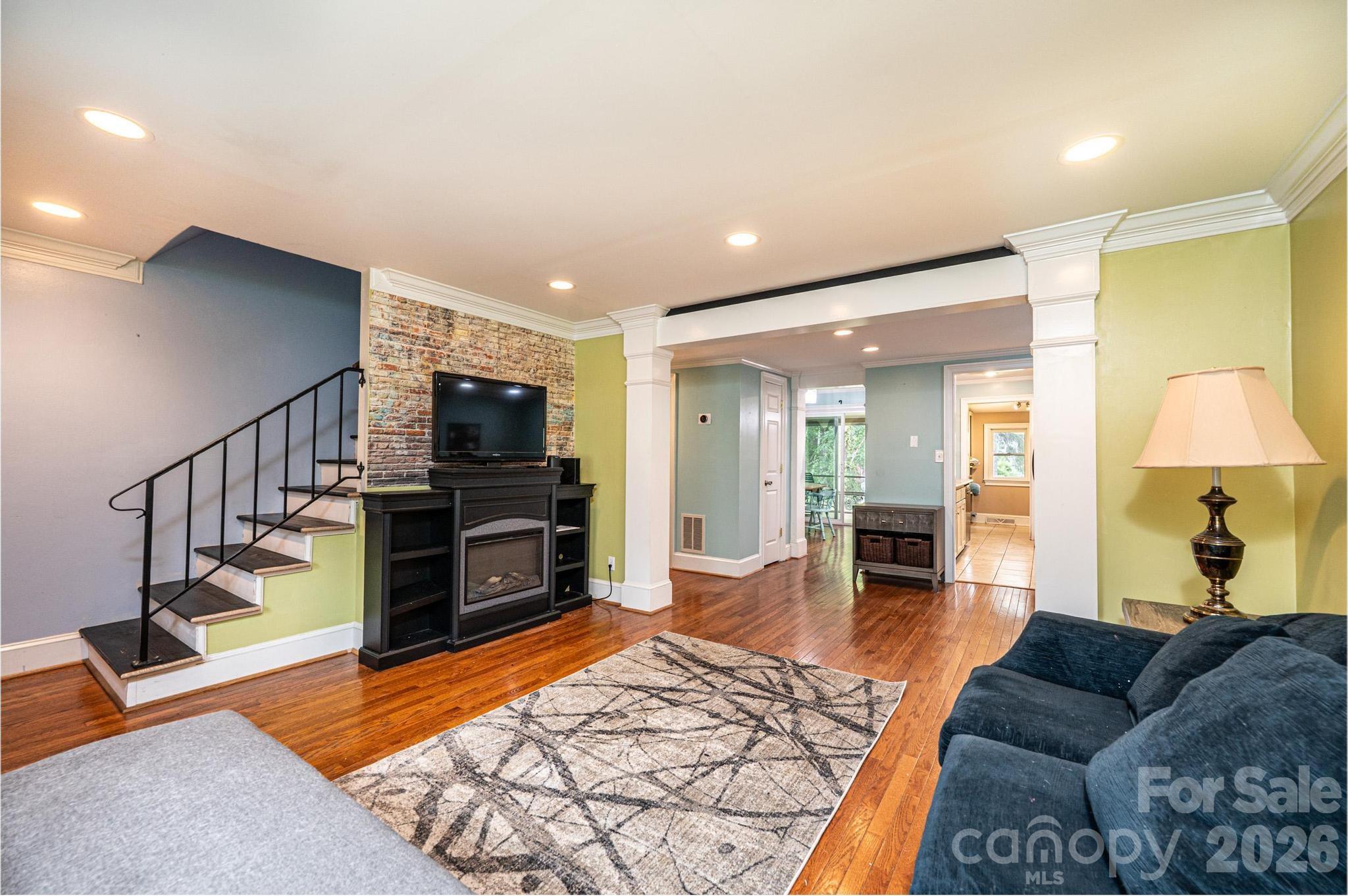826 6th Street Northwest, Unit 4 Hickory, NC 28601 - Photo 3 of 25 a living room with furniture and a flat screen tv