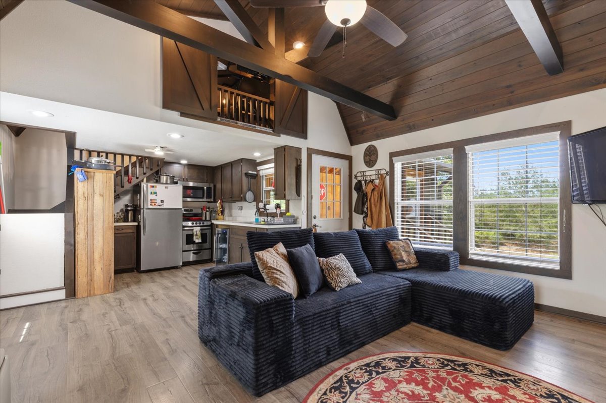 1705 Makinson Road West Point, TX 78963 - Photo 16 of 40 The open-concept design with vaulted ceilings and a well-appointed kitchen creates an inviting living space.