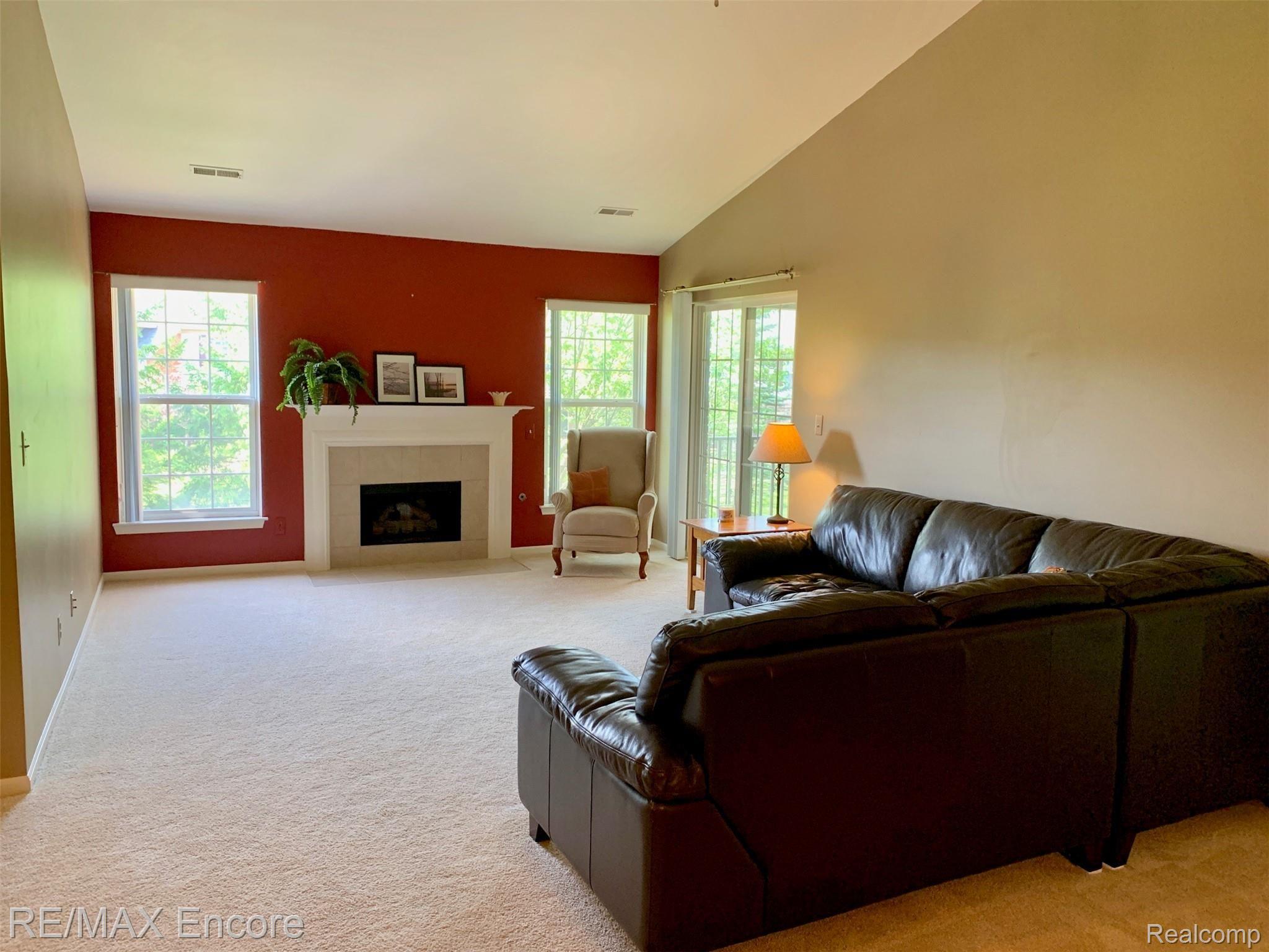 3522 Tremonte Circle Rochester, MI 48306 - Photo 7 of 31 Vaulted Great Room with gas fireplace and door to balcony