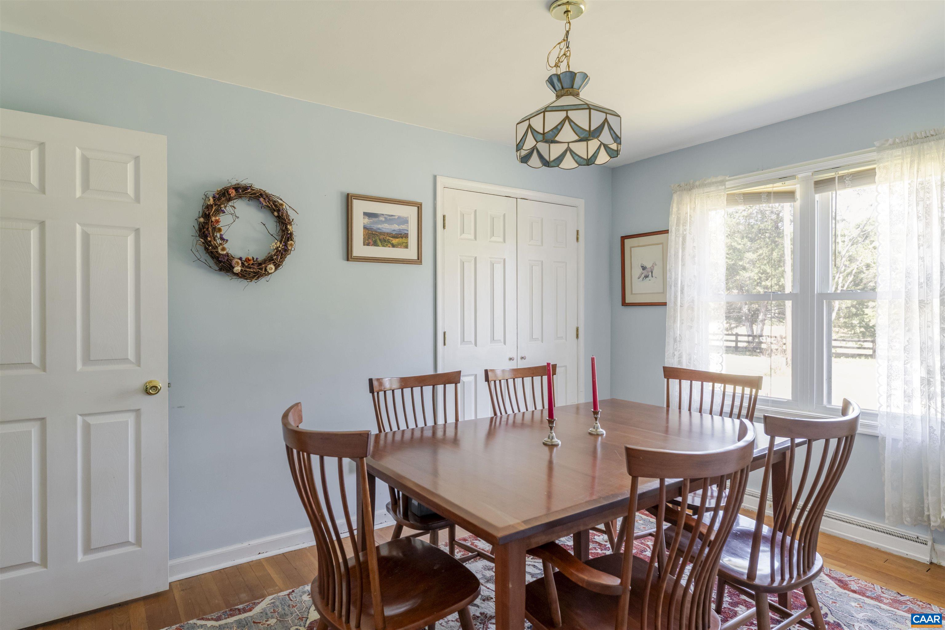 691 Old Roseland Road Roseland, VA 22967 - Photo 13 of 47 a view of a dining room with furniture window and wooden floor