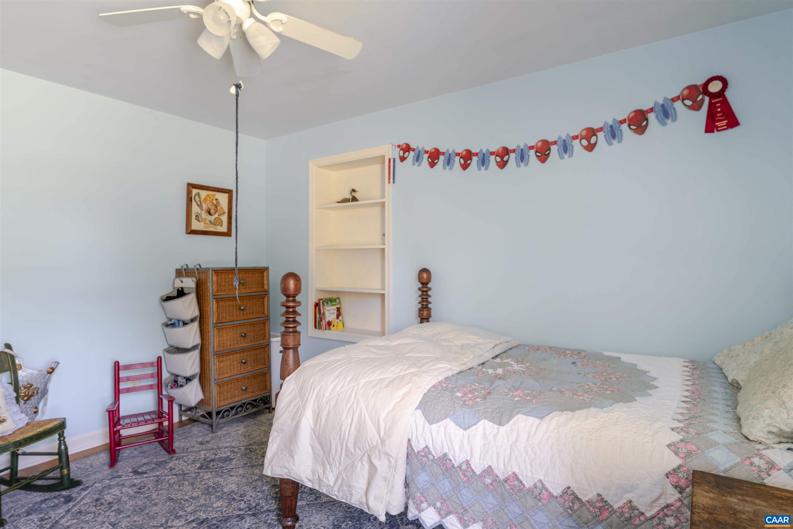 691 Old Roseland Road Roseland, VA 22967 - Photo 16 of 47 a bedroom with a bed and a chandelier