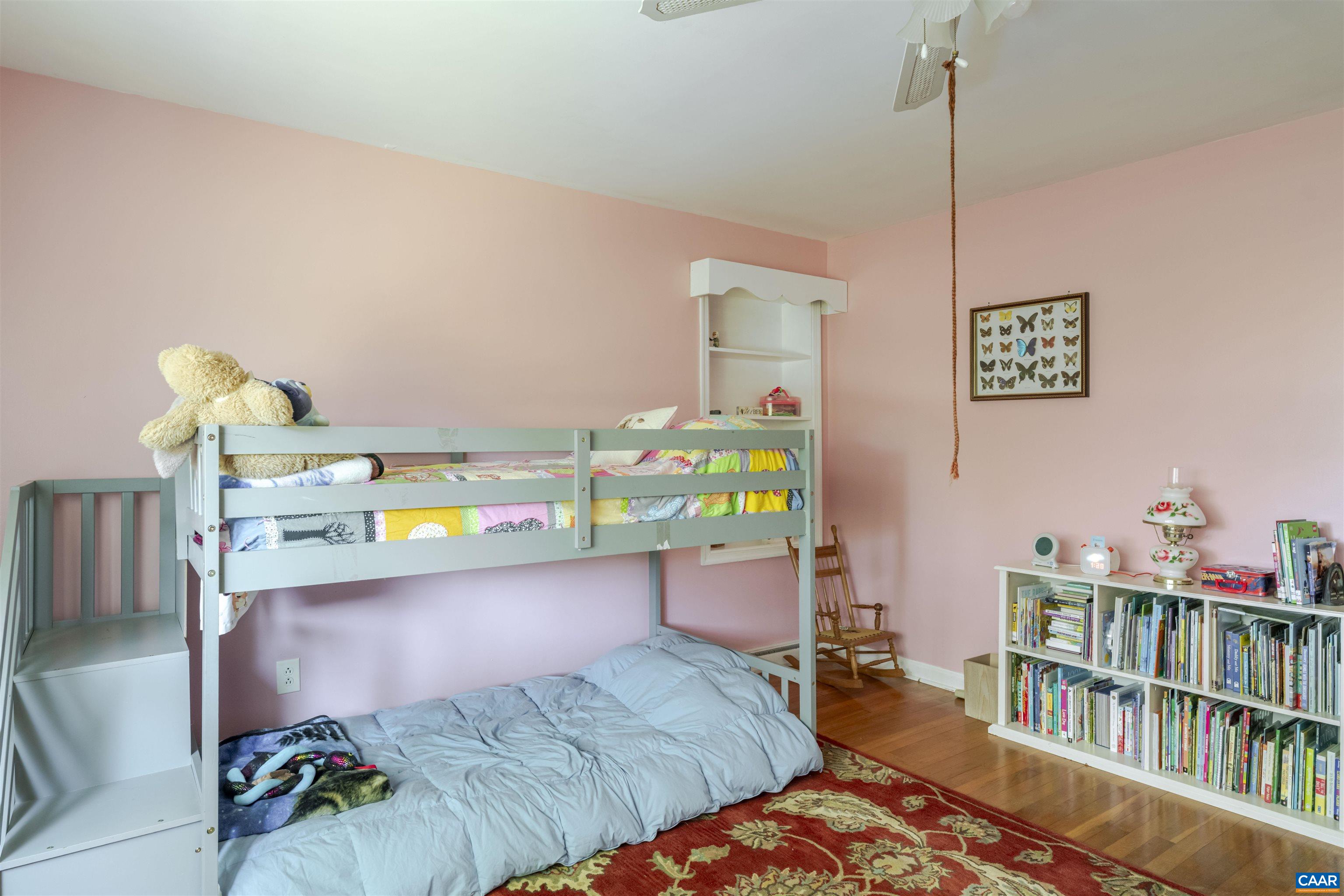 691 Old Roseland Road Roseland, VA 22967 - Photo 18 of 47 a bedroom with a bed and a table