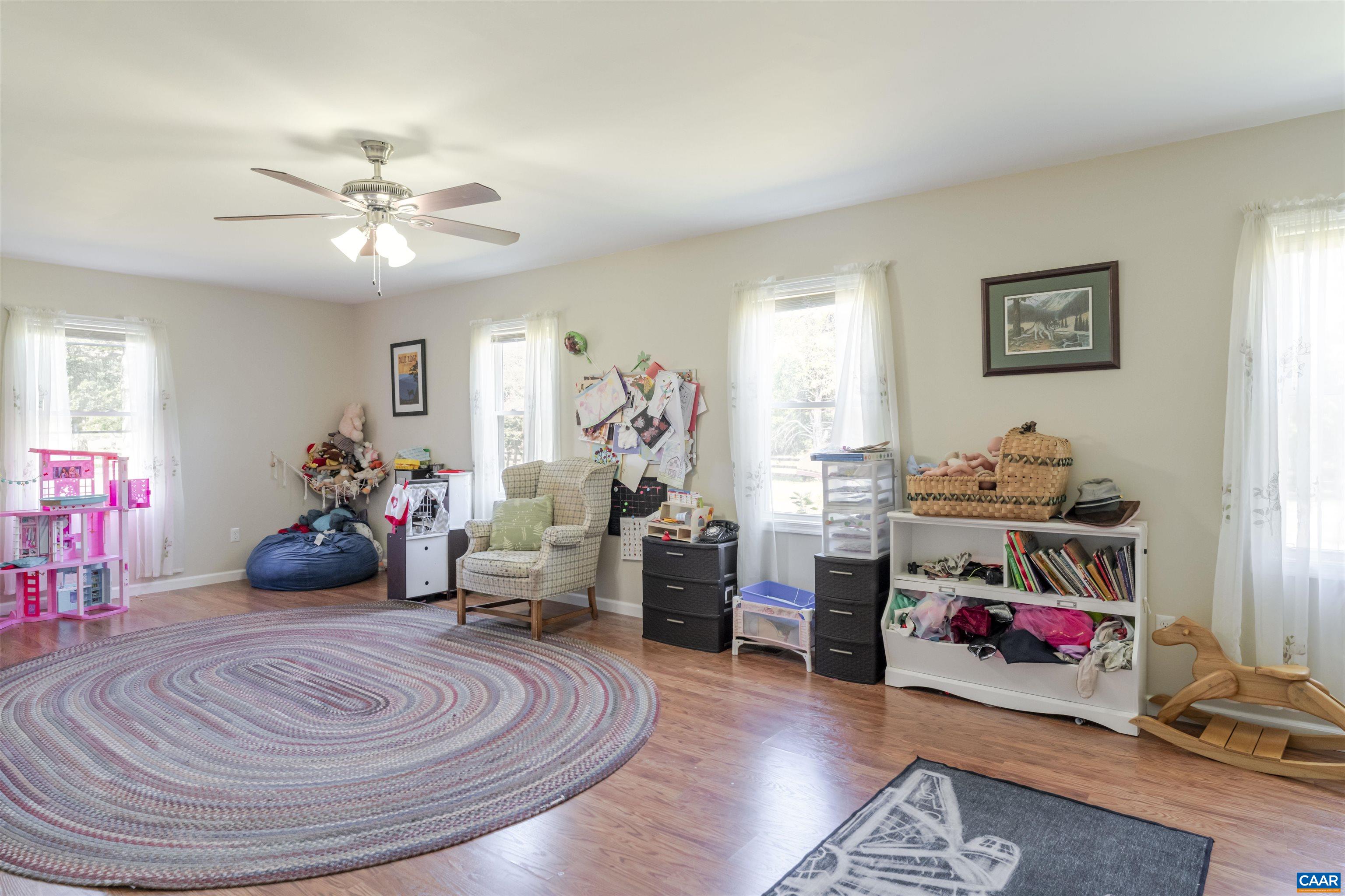 691 Old Roseland Road Roseland, VA 22967 - Photo 22 of 47 a room with furniture and a wooden floor