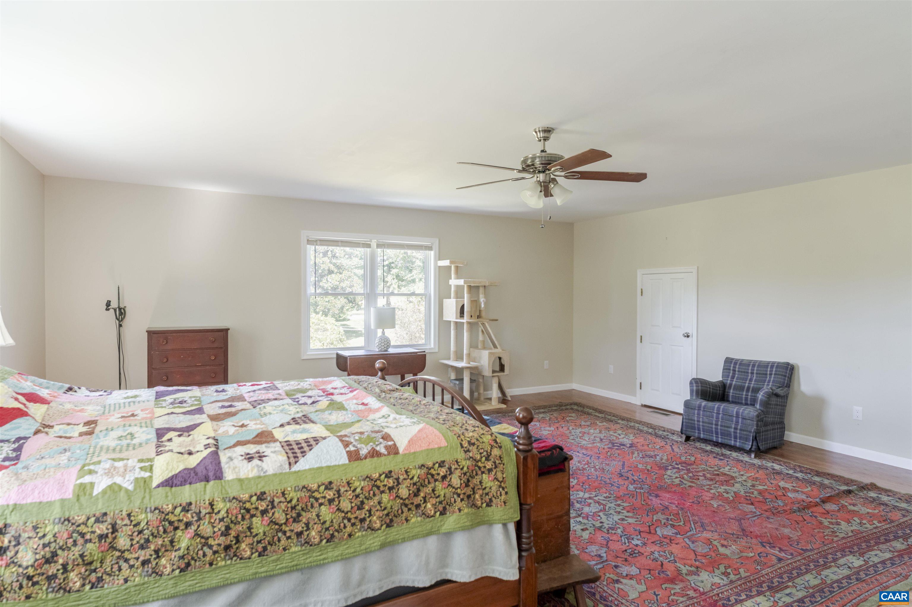691 Old Roseland Road Roseland, VA 22967 - Photo 25 of 47 a bedroom with a bed and a table in it
