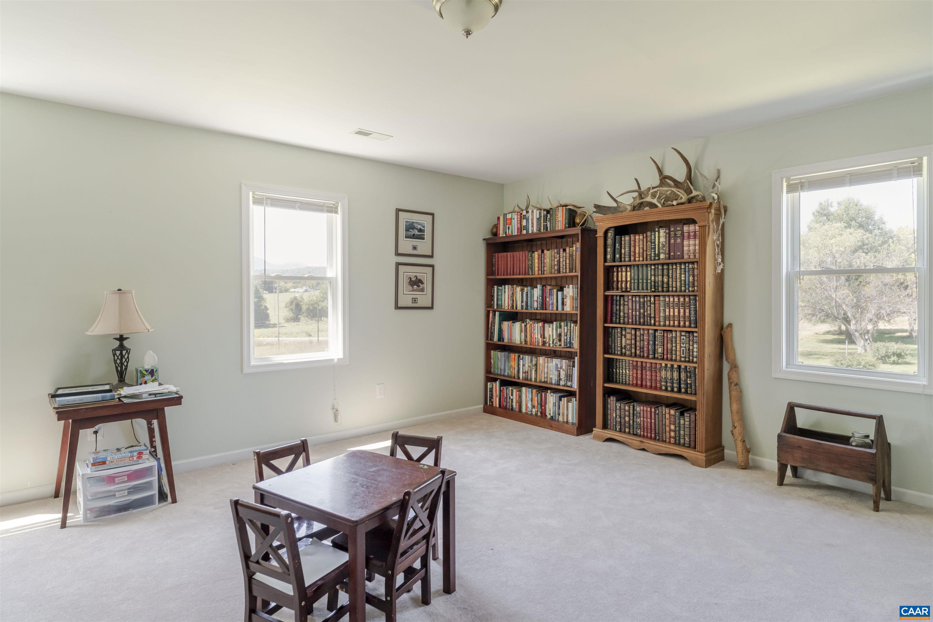 691 Old Roseland Road Roseland, VA 22967 - Photo 30 of 47 a livingroom with a window and lounge chair