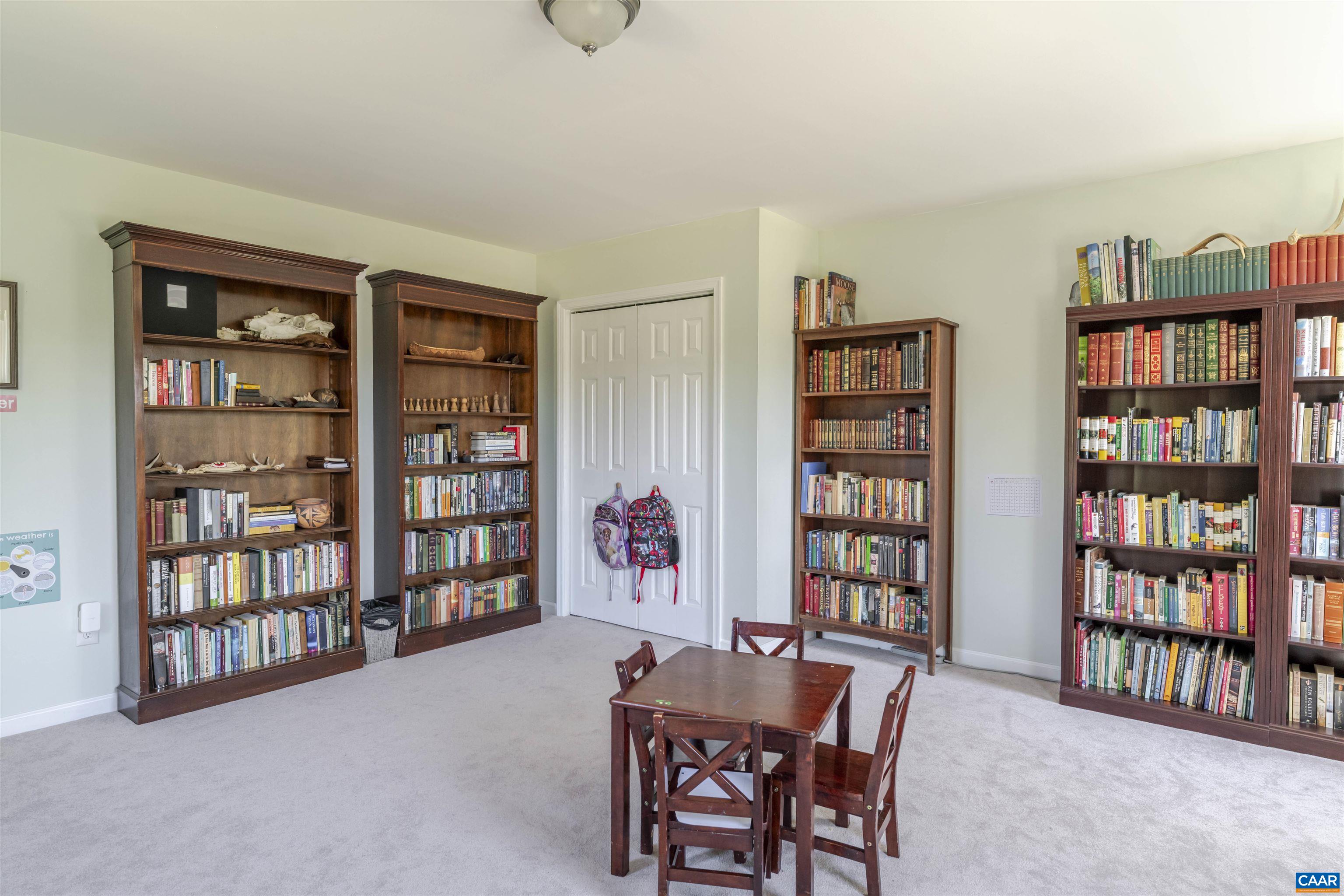 691 Old Roseland Road Roseland, VA 22967 - Photo 31 of 47 a dining room with furniture and a book shelf