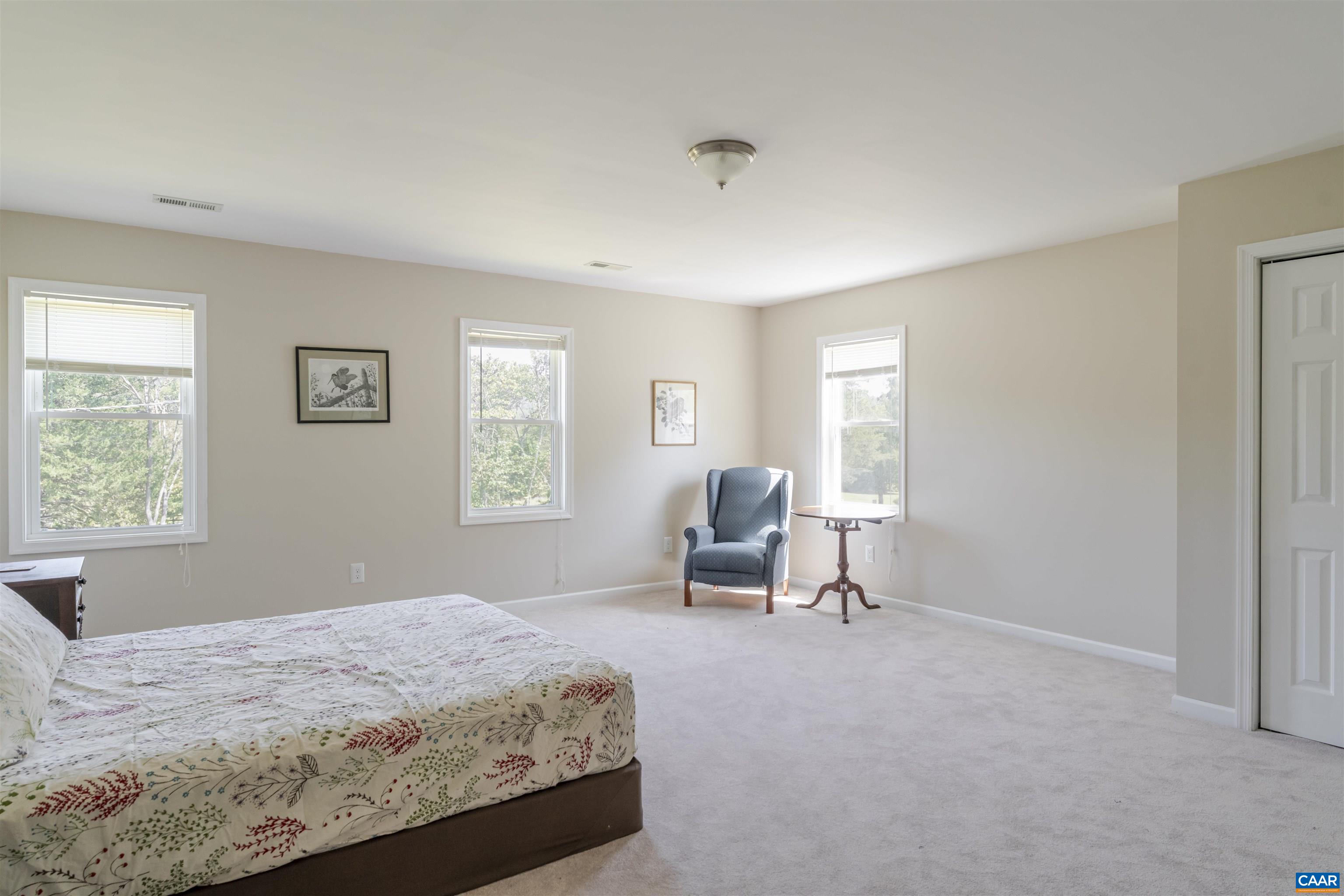 691 Old Roseland Road Roseland, VA 22967 - Photo 32 of 47 a bedroom with a bed a table and painting