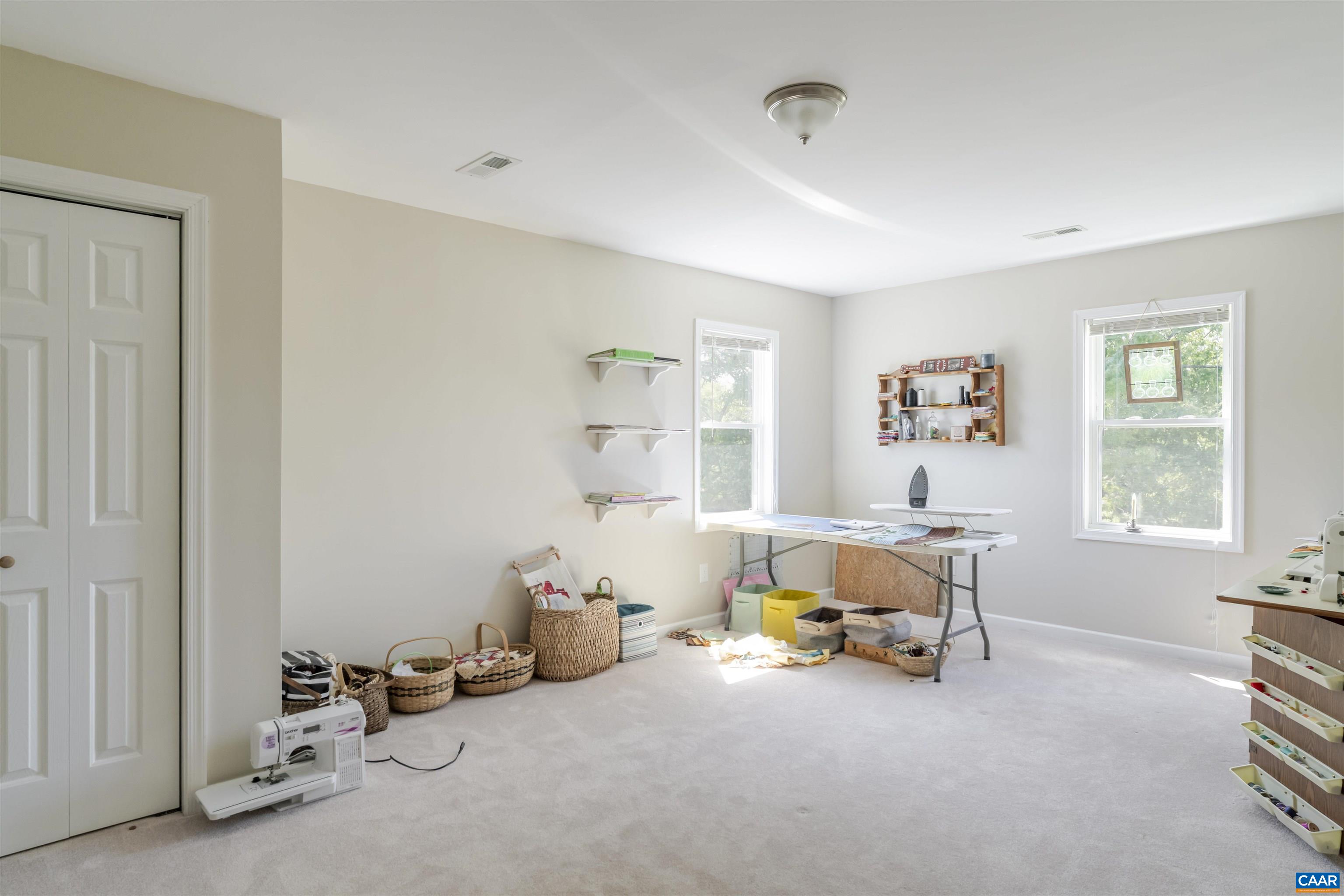 691 Old Roseland Road Roseland, VA 22967 - Photo 34 of 47 a bedroom with furniture and a window