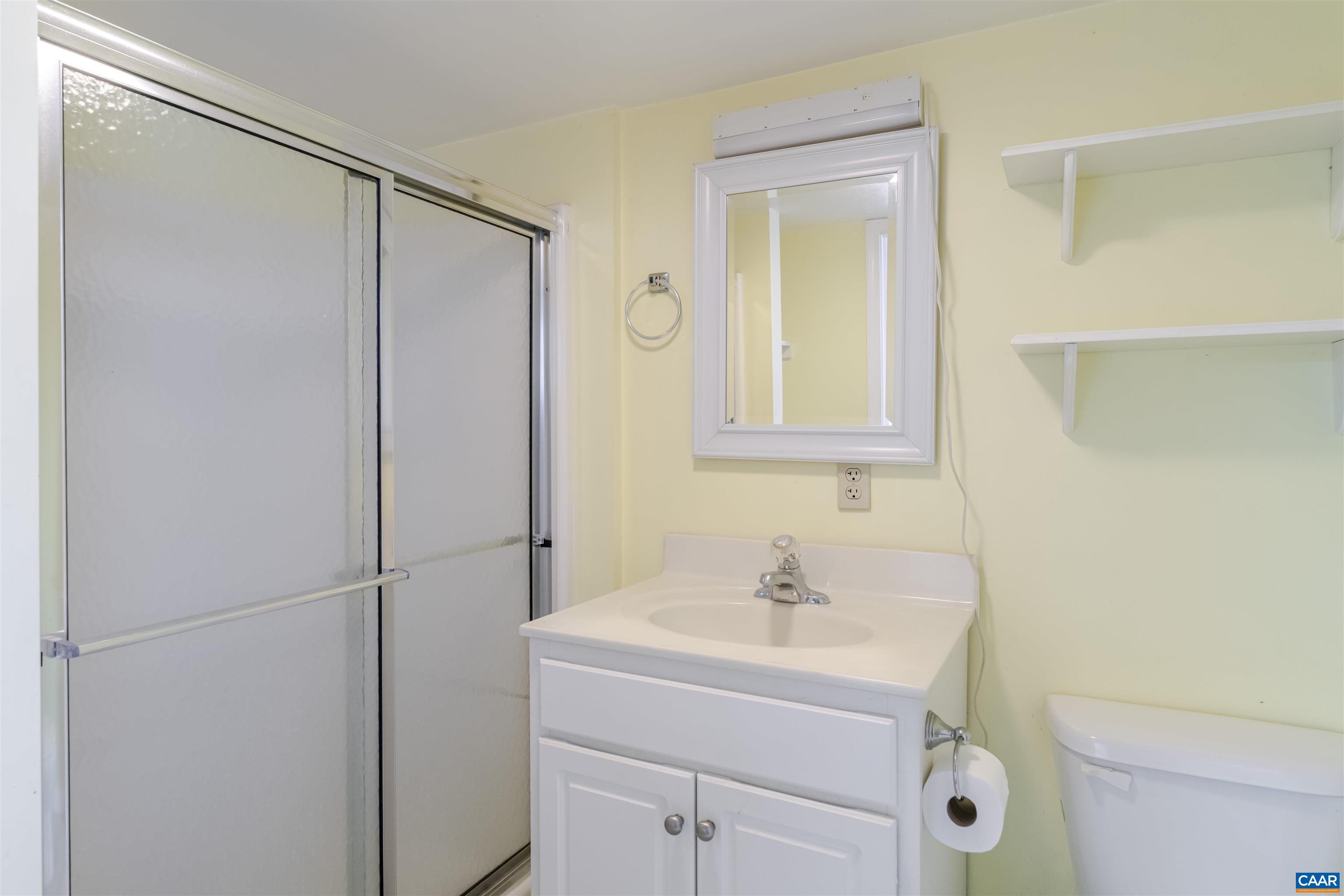 691 Old Roseland Road Roseland, VA 22967 - Photo 39 of 47 a bathroom with a sink toilet and vanity