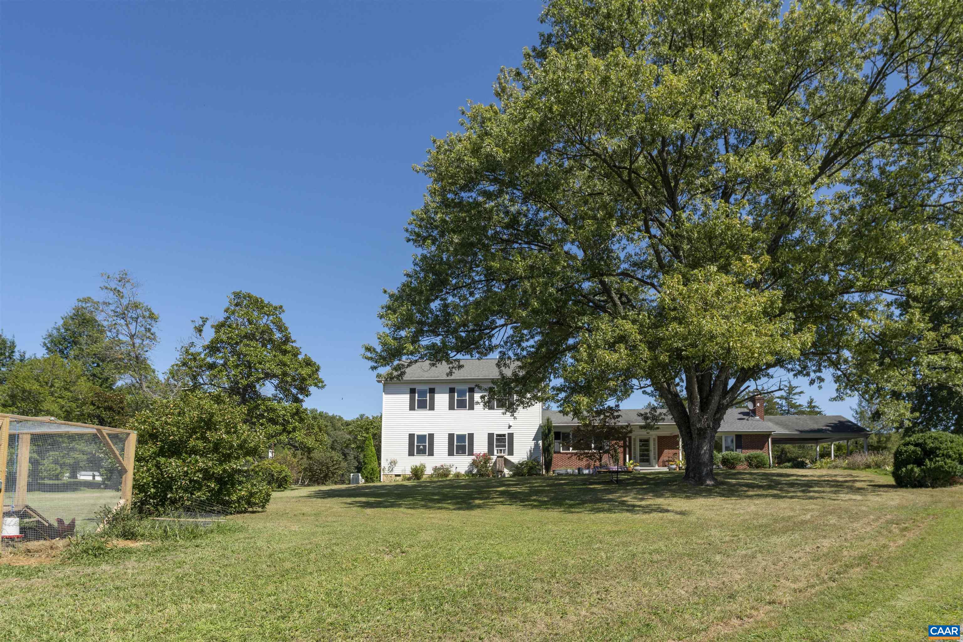 691 Old Roseland Road Roseland, VA 22967 - Photo 4 of 47 a front view of a house with a garden