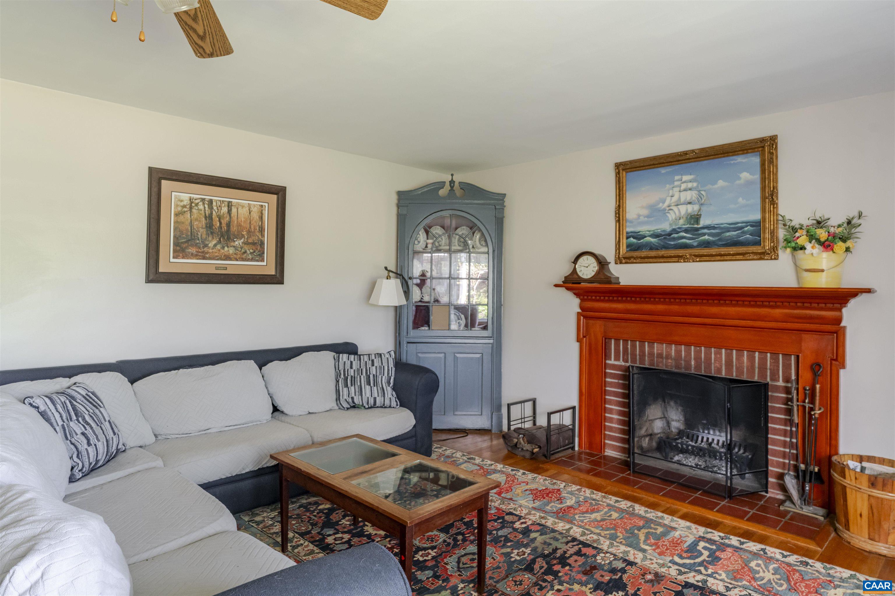 691 Old Roseland Road Roseland, VA 22967 - Photo 6 of 47 a living room with furniture a rug and a fireplace