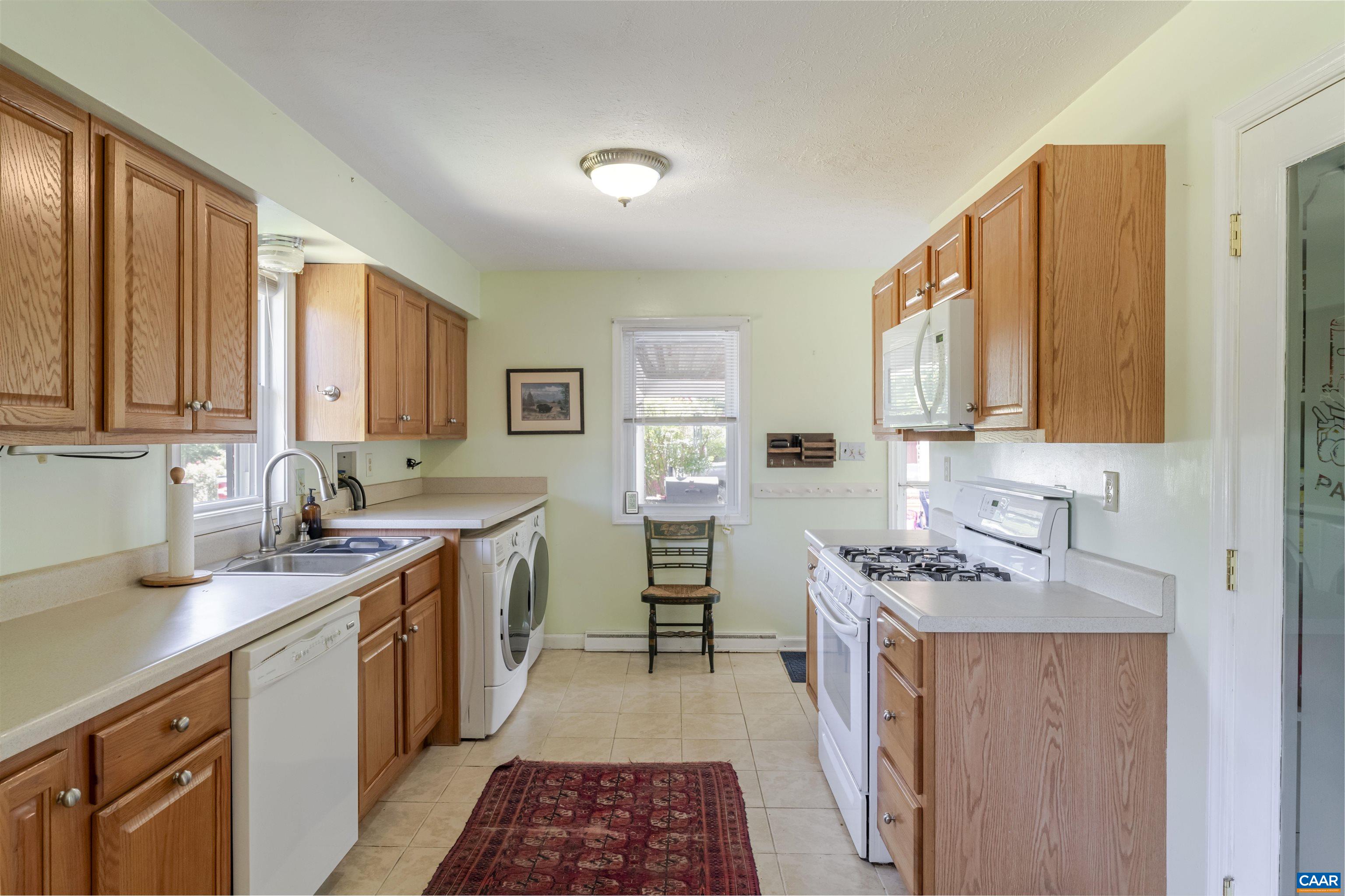 691 Old Roseland Road Roseland, VA 22967 - Photo 10 of 47 a kitchen with a sink stove and cabinets