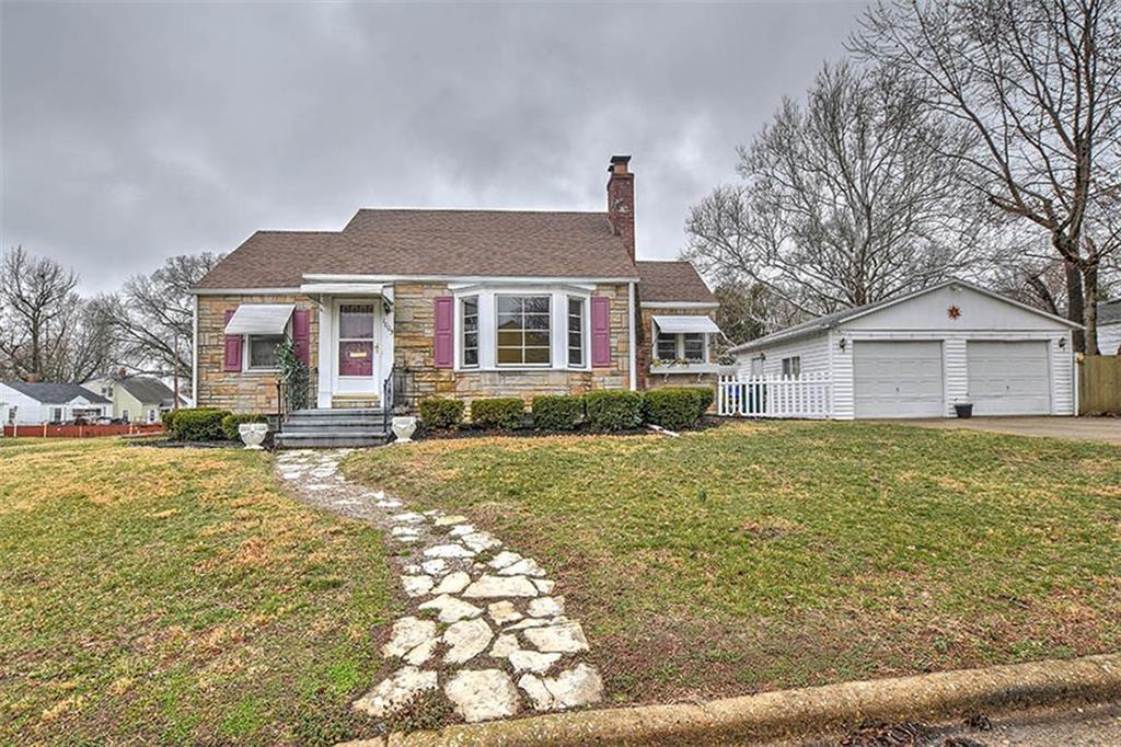 1005 North University Avenue Decatur, IL 62522 - Photo 1 of 1 a front view of a house with a yard and trees
