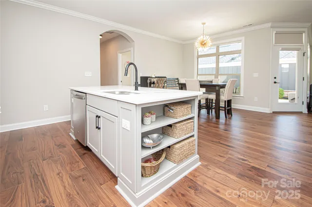 a view of living room with wooden floor and furniture