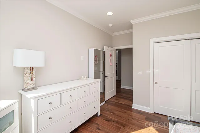 a spacious bathroom with a double vanity sink a mirror and a shower
