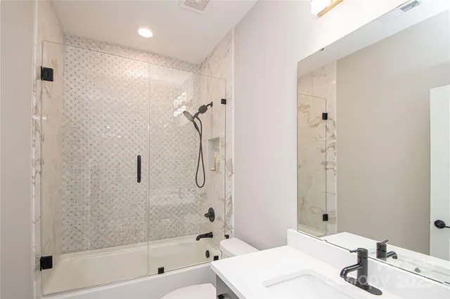 a bathroom with a bathtub and a sink