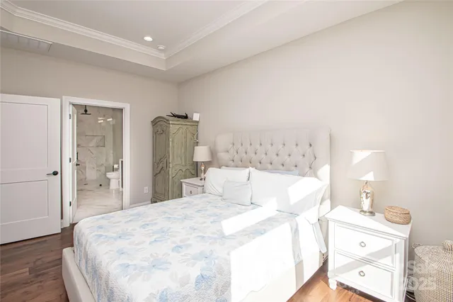 a large bed in a white room