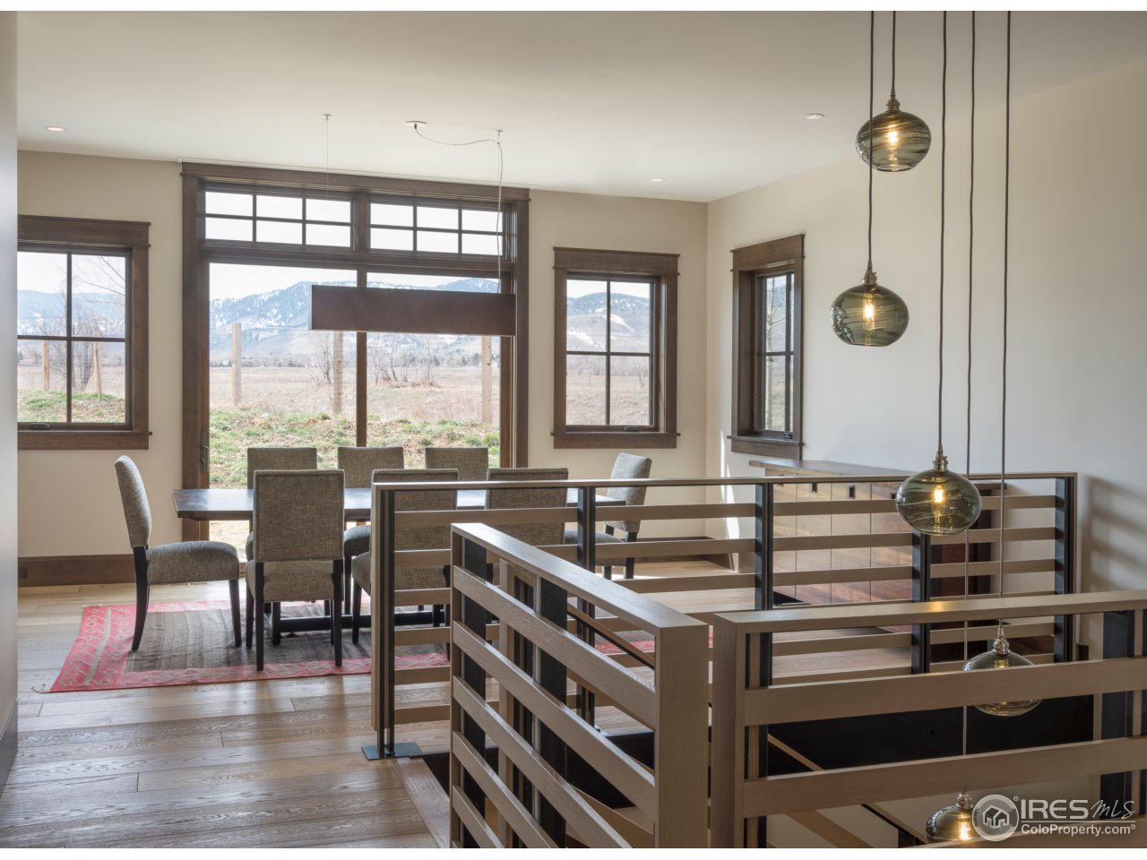 3840 Pleasant Ridge Road Boulder, CO 80301 - Photo 12 of 30 a view of a dining room with furniture wooden floor and chandelier
