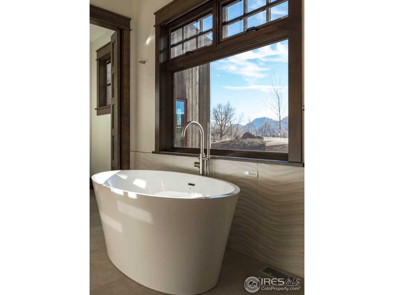 3840 Pleasant Ridge Road Boulder, CO 80301 - Photo 25 of 30 a white bath tub sitting in a bathroom