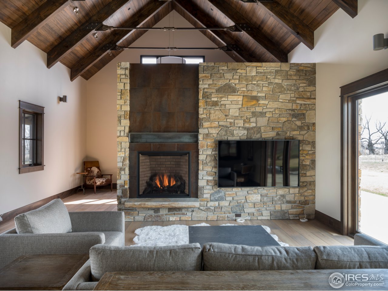 3840 Pleasant Ridge Road Boulder, CO 80301 - Photo 7 of 30 a living room with furniture and a fireplace