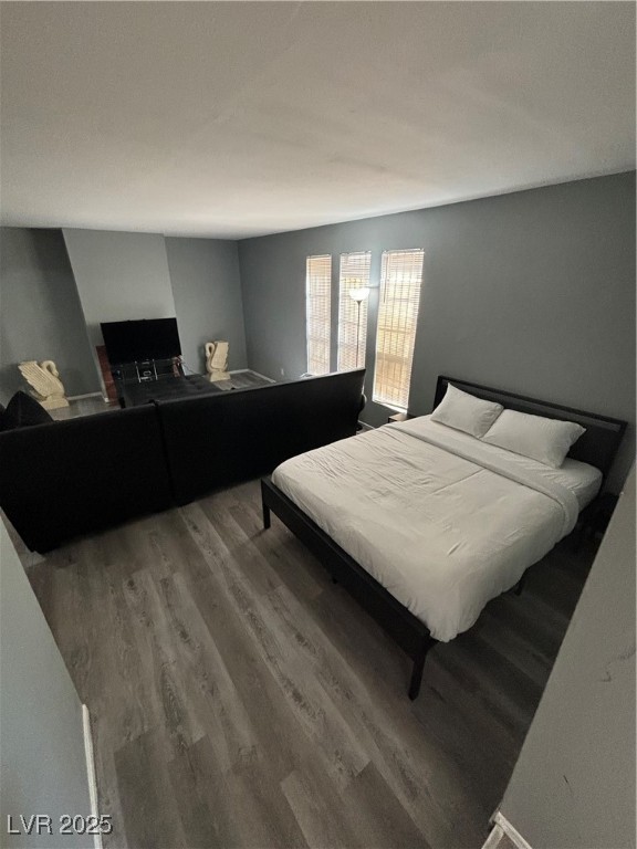 4640 Koval Lane, Unit 49A Las Vegas, NV 89109 - Photo 4 of 17 Bedroom featuring wood finished floors