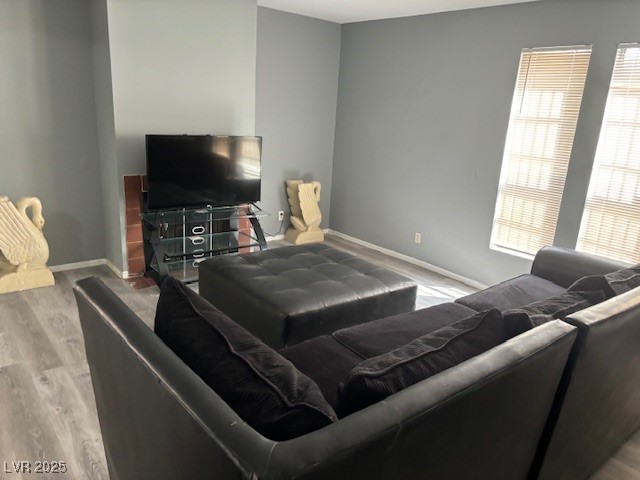 4640 Koval Lane, Unit 49A Las Vegas, NV 89109 - Photo 5 of 17 Living room featuring wood finished floors and baseboards