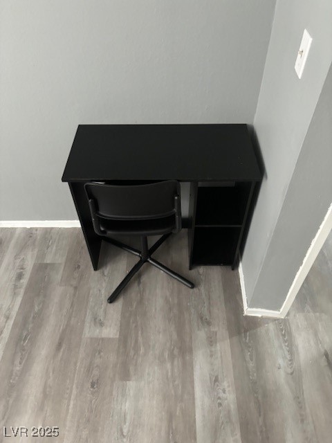 4640 Koval Lane, Unit 49A Las Vegas, NV 89109 - Photo 10 of 17 Detailed view of wood finished floors and baseboards