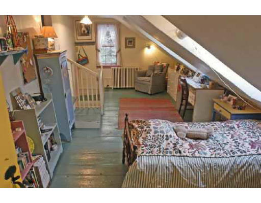 123 Audubon Road Northampton, MA 01053 - Photo 15 of 25 a bedroom with a bed and a walk in closet