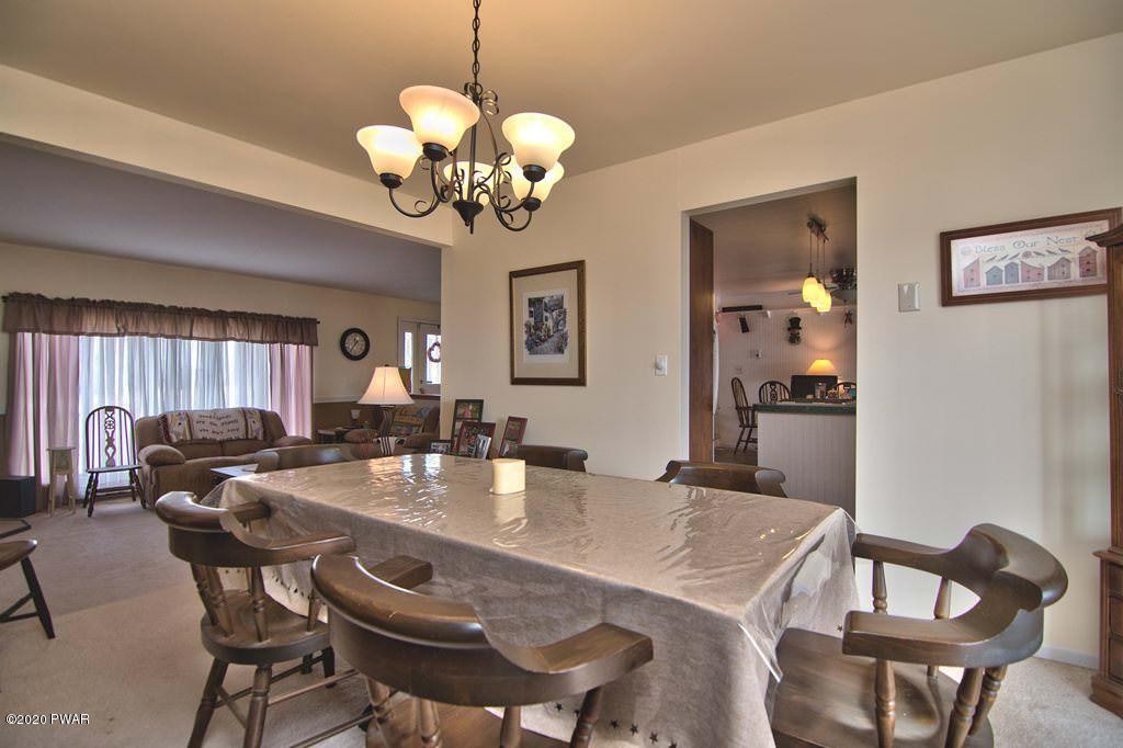 682 Stock Farm Road Lake Ariel, PA 18436 - Photo 20 of 78 a view of a dining room with furniture window and wooden floor