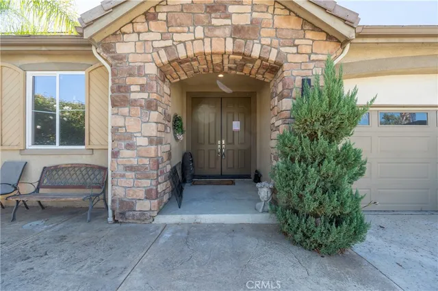 a view of front door of house with outdoor space