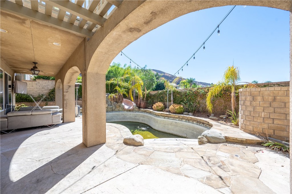 29276 Discovery Ridge Drive Saugus, CA 91390 - Photo 19 of 21 a view of a swimming pool with a patio