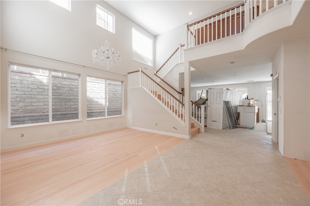 29276 Discovery Ridge Drive Saugus, CA 91390 - Photo 3 of 21 a view of empty room with stairs and windows