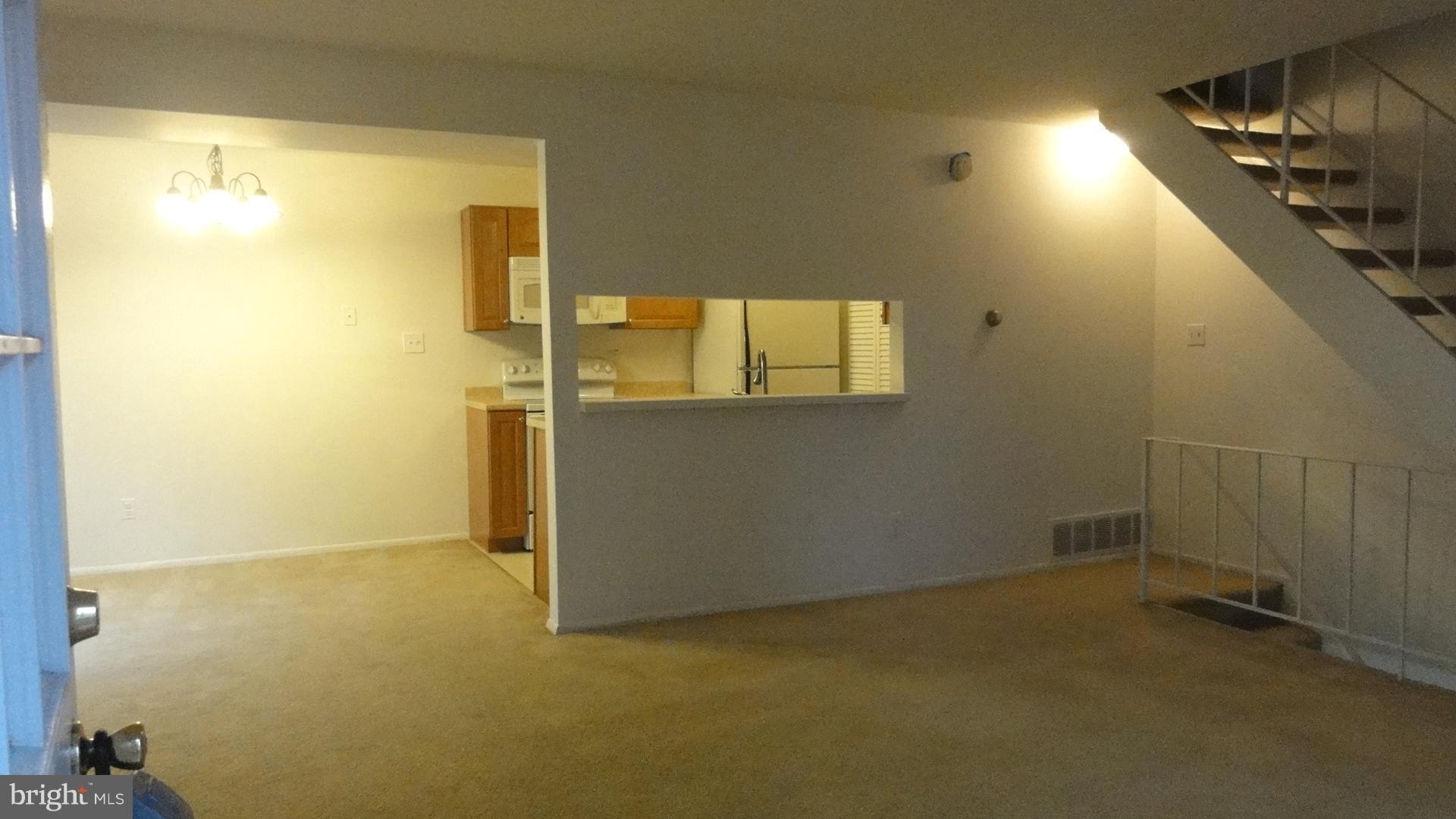 11 Benwell Road, Unit C Reisterstown, MD 21136 - Photo 2 of 16 Living Room, Dining Room & Pass thru to Kitchen