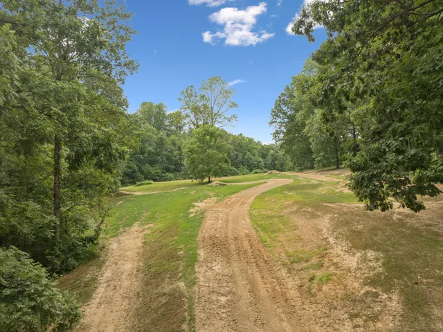 a view of a lake with a yard