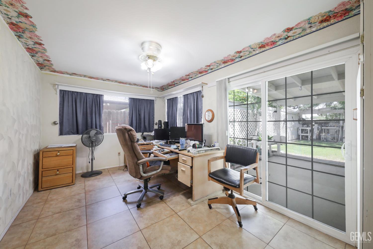 Undisclosed Address Bakersfield, CA 93309 - Photo 18 of 22 a view of a livingroom with workspace and a window