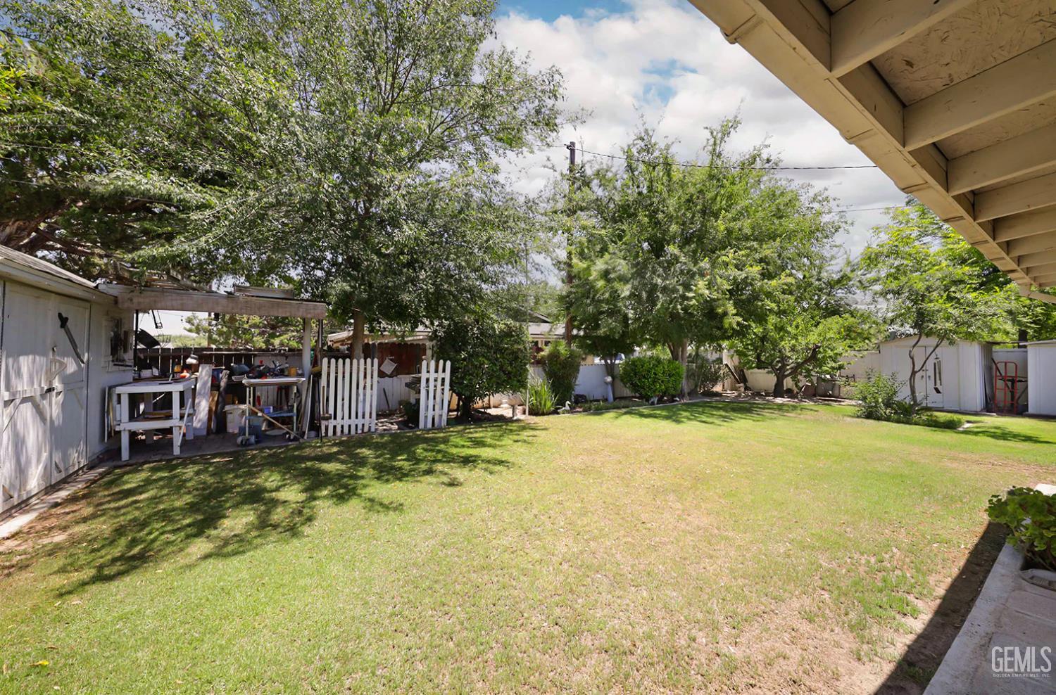 Undisclosed Address Bakersfield, CA 93309 - Photo 21 of 22 a view of a backyard with a small cabin