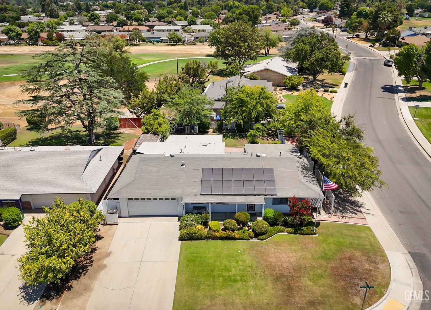 Undisclosed Address Bakersfield, CA 93309 - Photo 4 of 22 an aerial view of a house with a yard and lake view